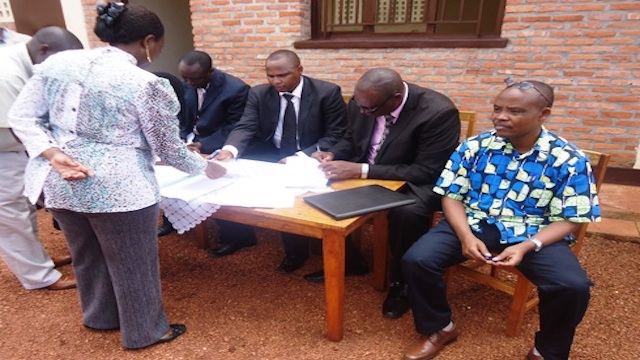 Alfred Nkubili, Rwandan Businessman signing business deals