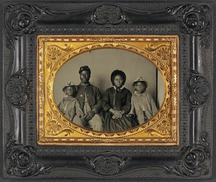 Photograph of an African-American soldier and his family. Exposition at the Library of Congress, under "The Last Full Measure: Civil War Photographs from the Liljenquist Family Collection," in August 2011