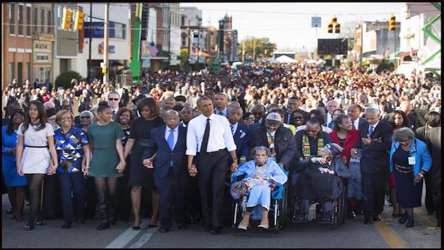 US Civil Rights Activist and Selma Icon  Amelia Boynton Robinson crossing Selma Bridge with President Obama