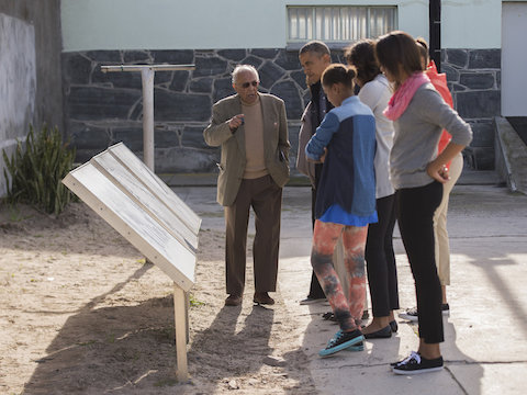 Ahmed Kathrada gives VIP tour of Robben Island Museum to President Obama and his family, in 2013
