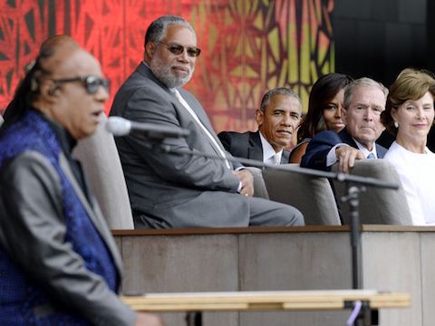 President Obama and Bush listen to Stevie Wonder's  music during the dedication ceremony of  Smithsonian African American History and Culture Museum in DC on Sep 24, 2016